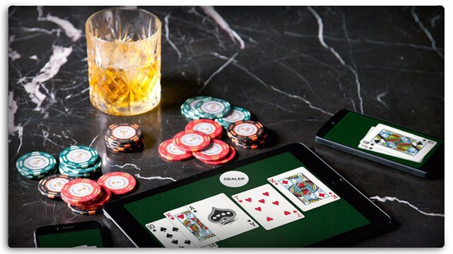 Online Poker Sites - Tablet - Smartphones - Glass of Whisky and Casino Chips
