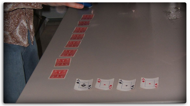 Horse Race Card Game Being Set Up With L Shape And Four Aces Showing